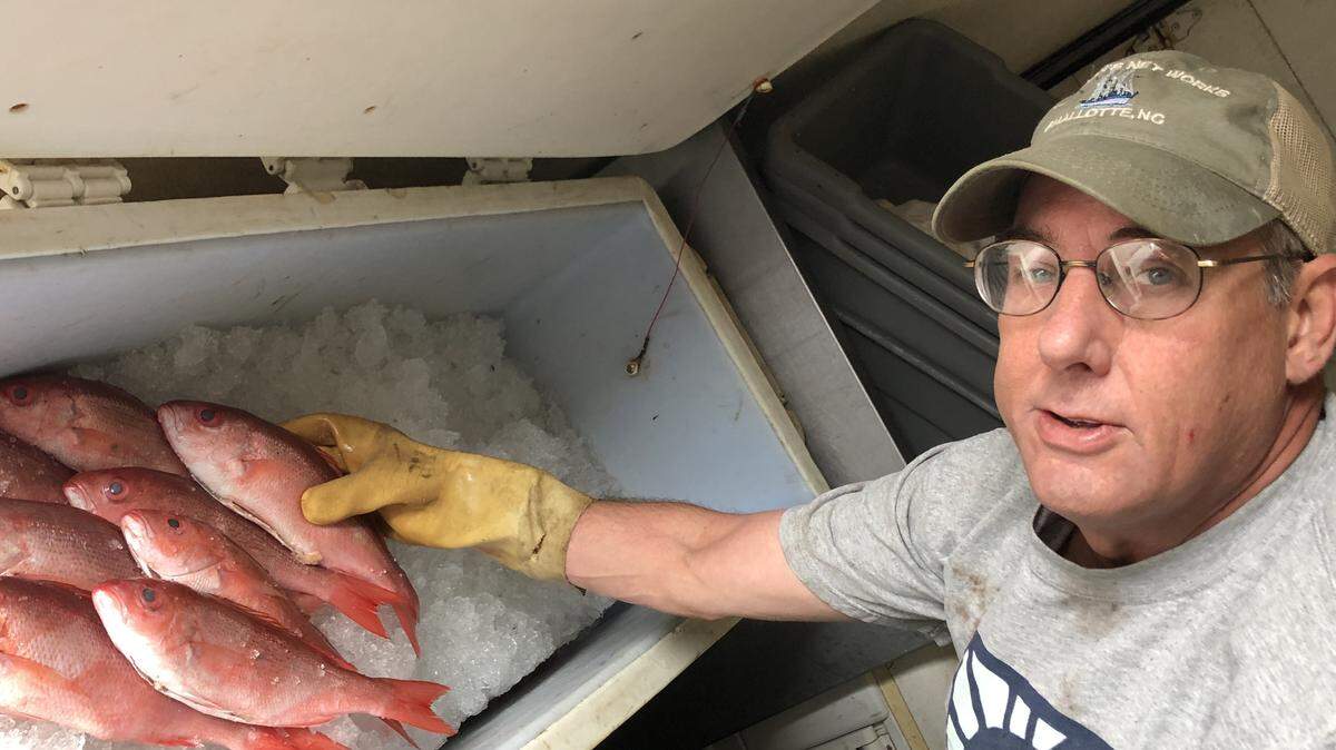 Photo by Ben Jarrell<br>Tim Griner, owner of Charlotte Fish Company, with his catch of Vermilion snapper.