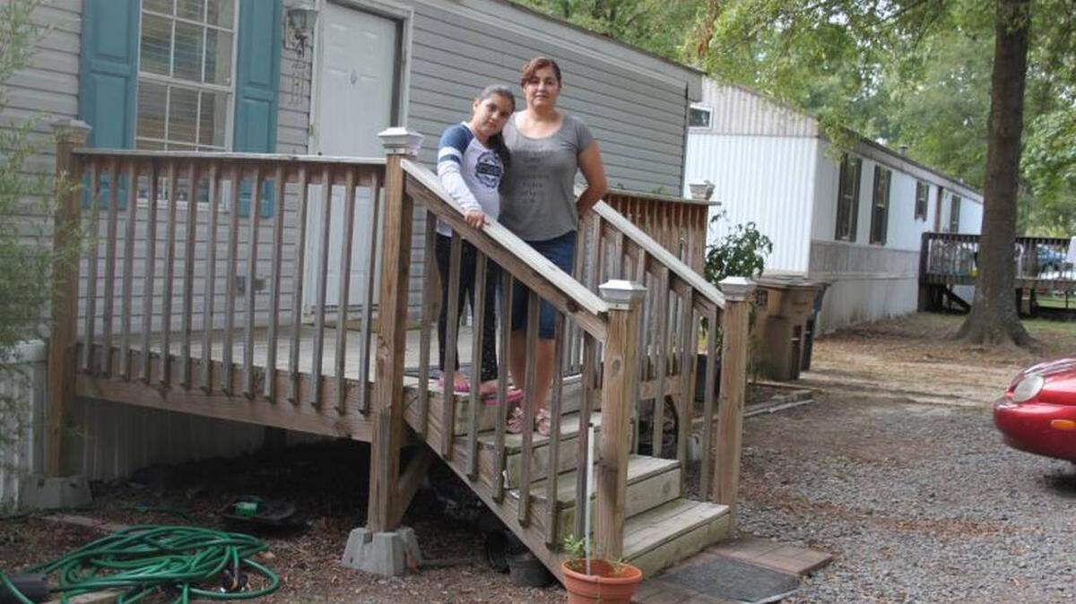 La Noticia<br>Rosa Sanchez with her daughter, Angy. Eight days after moving in, she learned that the mobile home park off Independence Boulevard was about to be for sale to a developer who would build luxury apartments on the property.