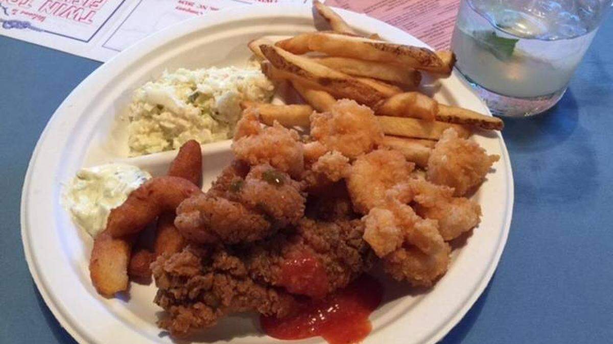 The main course at the Fish Camp Supper: Salt and pepper catfish, fried wild shrimp, hushpuppies, fries and coleslaw from Twin Tops.
