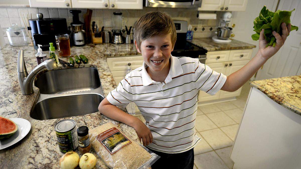 Alex Tschegg, 8, of Matthews, NC is one of 50 children  invited to the White House in July as part of Michielle Obama's healthy lunch initiative. One child from each state was chosen. Alex's recipe includes chickpeas, tofu, onions, curry powder, brown rice, 1/2 a cup of milk and fresh lettuce from the garden.