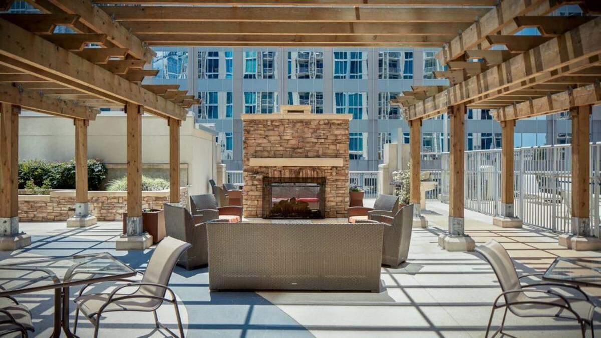 Courtesy of Northwood Ravin<br/>Outdoor living space with fireplace