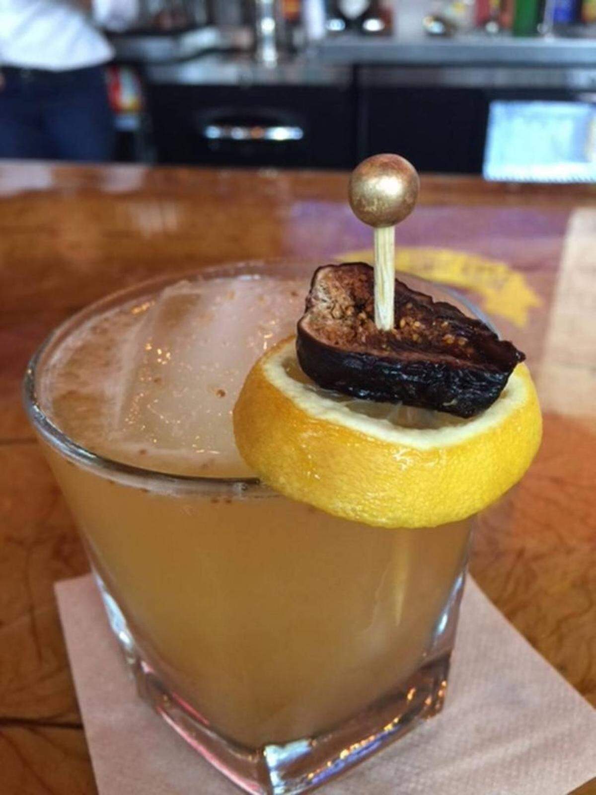 One signature cocktail is the Tobacco Road, with Bulleit, orange liqueur, lemon, housemade fig jam and caramelized honey, garnished with a dried fig and lemon wheel. All cocktails are $12.