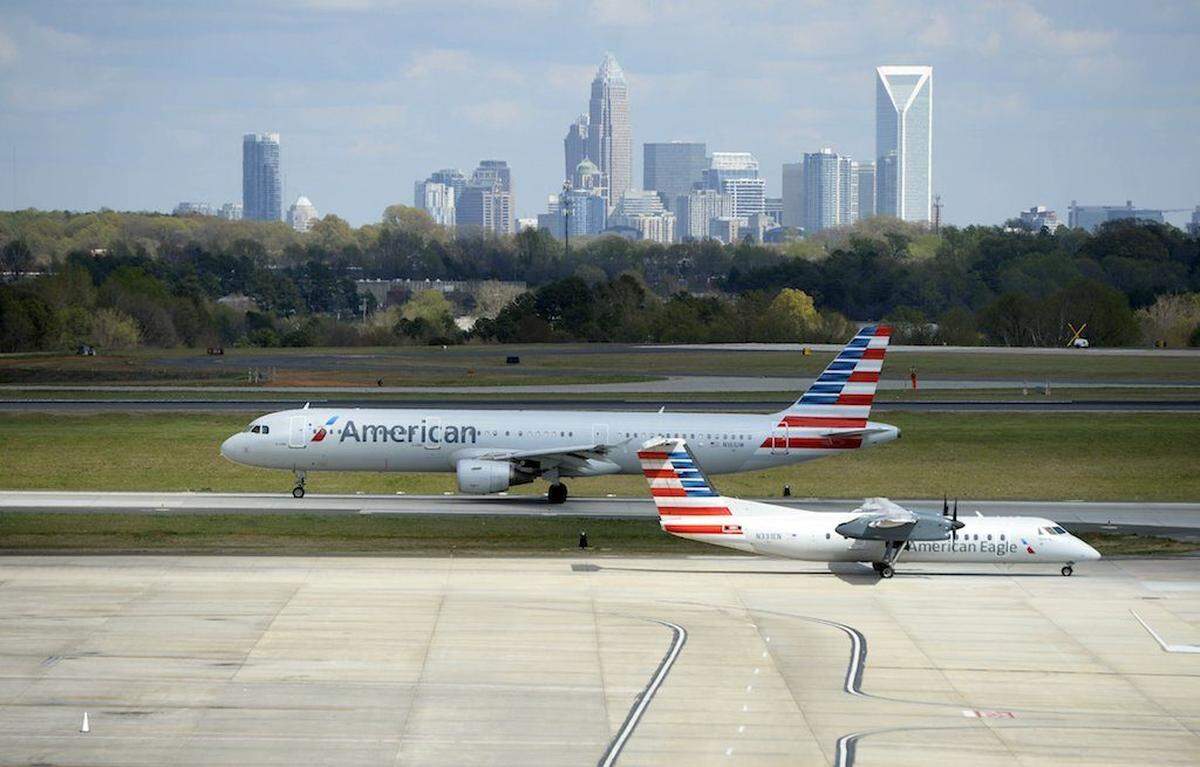 American Airlines airplanes taxi along at Charlotte Douglas International Airport on Wednesday, March 29, 2017. American Airlines has completely renovated its Hub Control Center, formerly known as the ramp control tower. With a more than $5 million investment, the tower now features new facilities, more efficient use of space, employee break and work areas, as well as new restrooms and conference rooms. The Hub Control Center is the nerve center of American's operation in CLT. The facility had not been renovated since American moved into the facility in 1996.