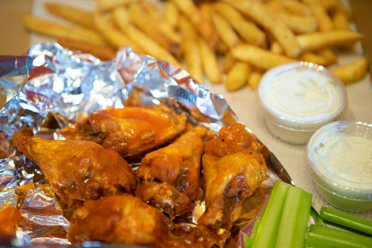 Photo by Alex Cason<br />Wings and fries from Chi's Pizza