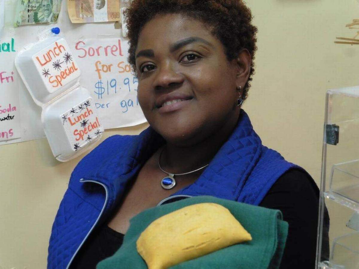 Jamaican-born Caroline Coke at Island Grocery sells beef and chicken patties made by her sister Valma Baker.