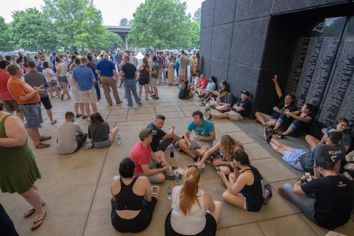 Photo by Alex Cason Photography<br/>Untappd Beer Festival attendees wait out the storm delay inside the concourse at Bank of America Stadium.