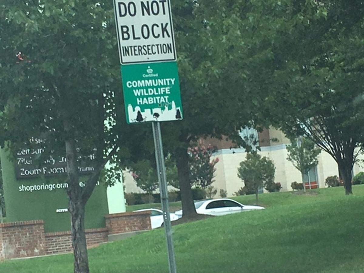 Community Wildlife Habitat sign along Johnston Road in the Ballantyne area