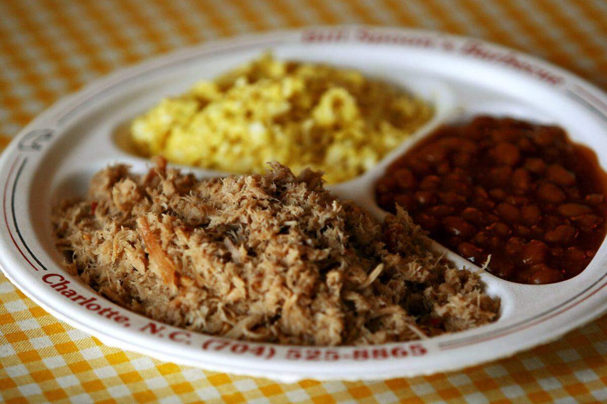 Bill Spoon's Barbecue has been at 5524 South Blvd. for the past 45 years. Current owner Steve Spoon (CQ), who is the grandson of Bill Spoon (CQ), serves Eastern-style pork barbecue, which is vinegar-based. Also pictured are baked beans and coleslaw. JASON E. MICZEK - Special to the EYE