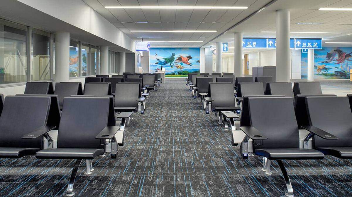 Photo by Sean Busher Imagery<br/>As part of the renovation, the airport installed 950 new chairs, each with a charging port.