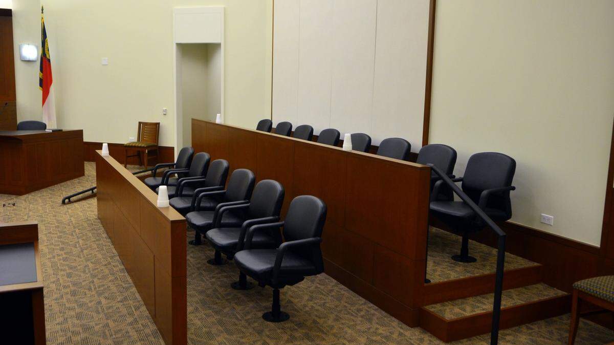 An empty juror's box in a sixth-floor courtroom at the Mecklenburg County Courthouse. Photo made Friday 7/25/2014.