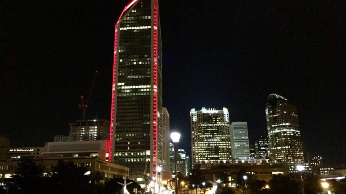 Lights from the Duke Energy Center illuminates the uptown Charlotte evening skyline on October 30, 2015.