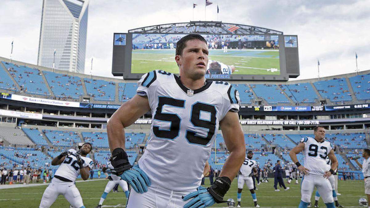 In this photo taken Aug. 28, 2015,  Carolina Panthers' Luke Kuechly (59) stretches before a preseason NFL football game against the New England Patriots in Charlotte, N.C. A person familiar with the situation says Luke Kuechly has agreed to a five-year $52 million contract extention with the Panthers, making him the highest-paid middle linebacker in the NFL. The person spoke to The Associated Press on Thursday, Sept. 10, 2015, on condition of anonymity because the move hasn't been announced. (AP Photo/Bob Leverone)