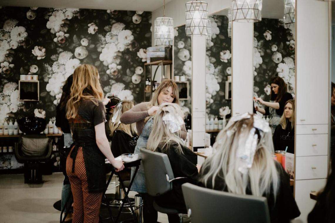 Photo by Erin Maynard<br>Cait McNulty (left) and Lauren Spence use the enneagram at work at Kenna Kunijo salon with both co-workers and customers.