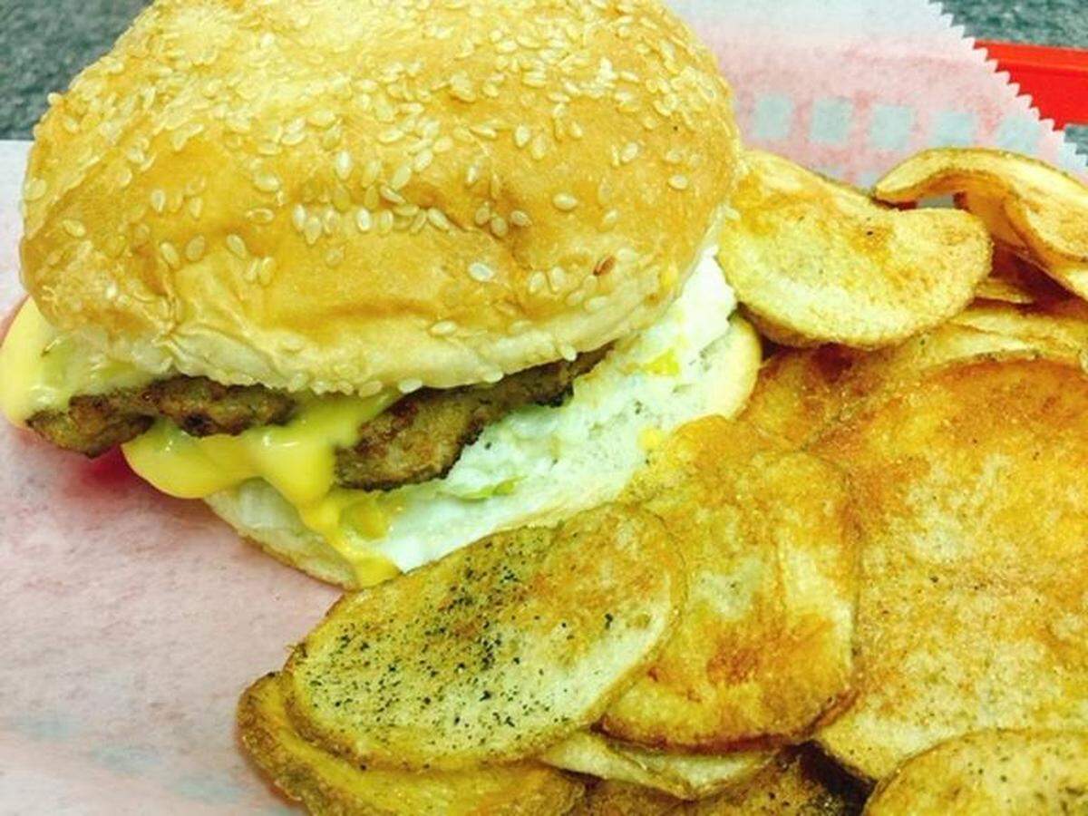 The Dixie Grill’s very cheesey cheeseburger has cheese on the bottom, in the middle and on the top.