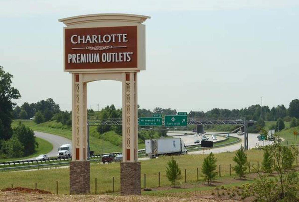 Greg Norman and Huk sports apparel retailers plan to open this summer at Charlotte Premium Outlets.