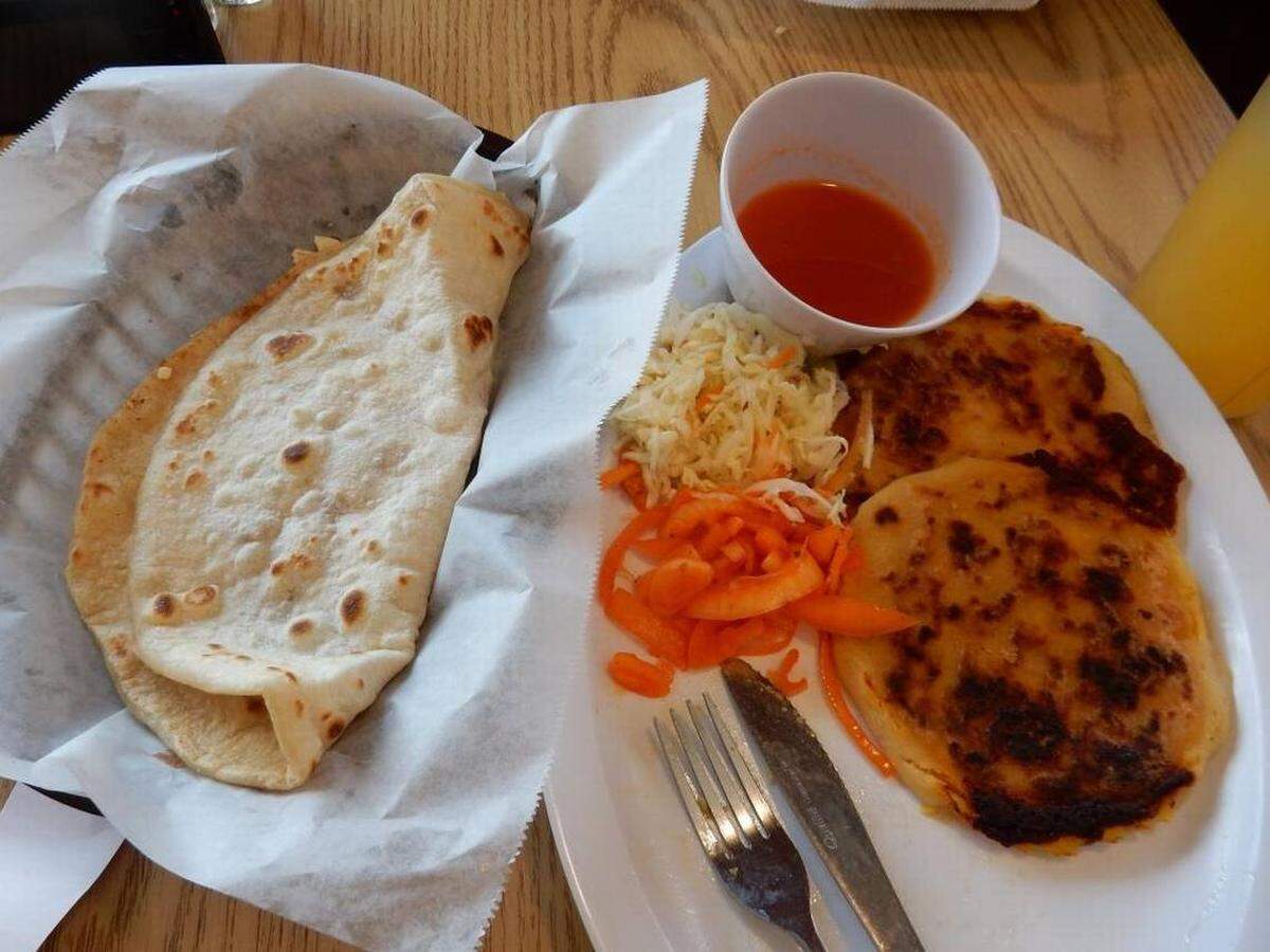 At Delicias Restaurant Latino, a Honduran baleada, left, is just $2. At right are two Salvadoran pupusas, $1.90 each.