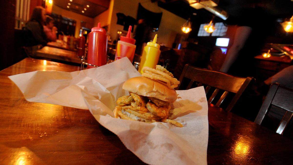The White Trash burger is a speciality of the new Pinky’s Westside Grill. The burger contains fried pickles, fried onion rings, provolone cheese and spicy ranch dressing.

DAVID T. FOSTER III - dtfoster@charlotteobserver.com