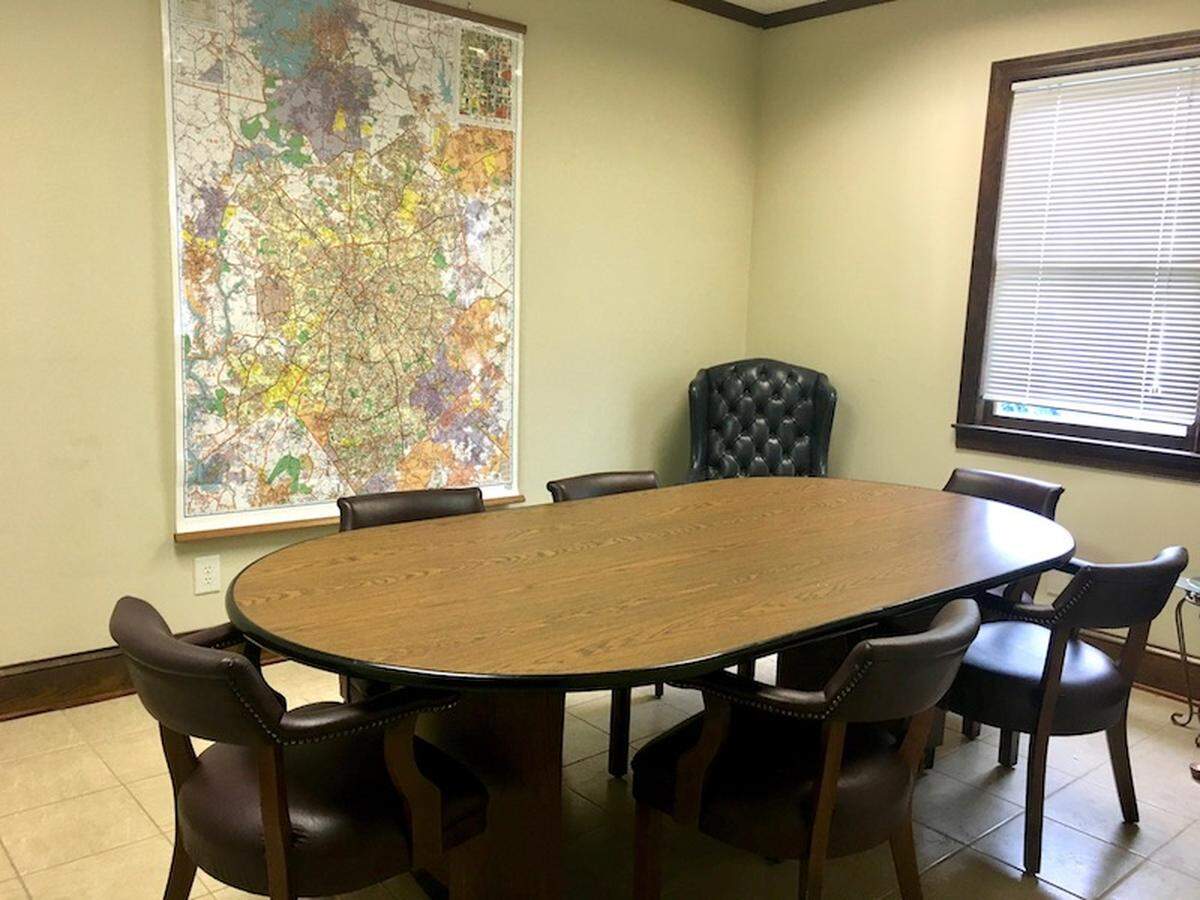 Conference room with map of Charlotte.