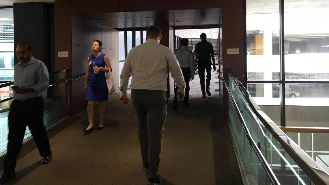 Photo by Jillian Mueller<br>Uptown workers stroll through collections to Overstreet Mall.