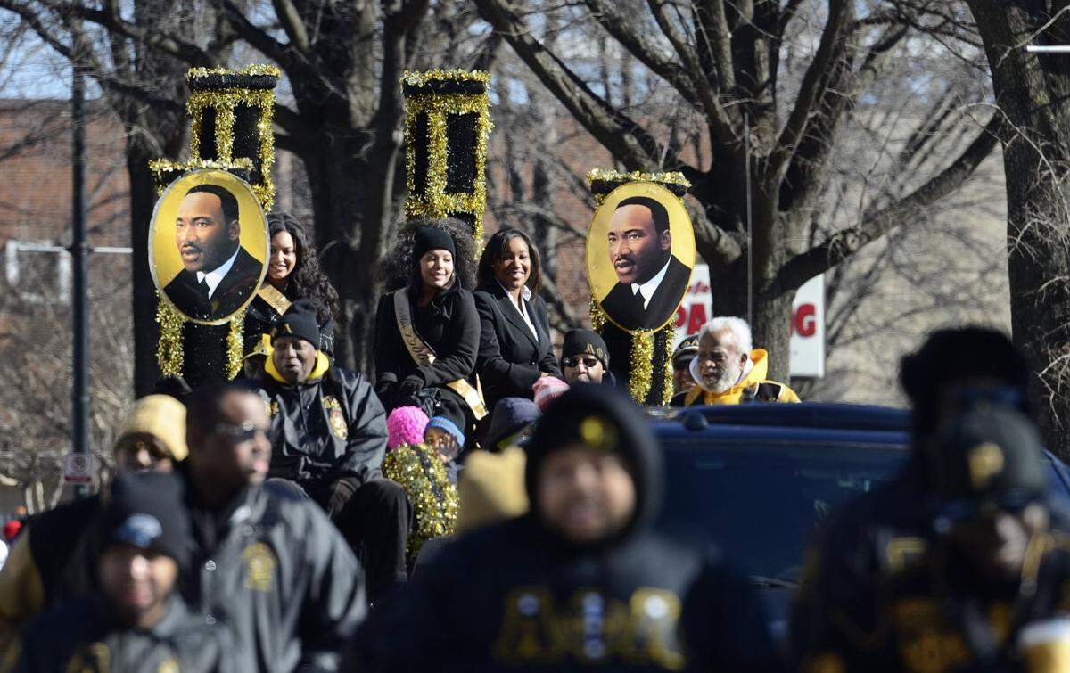 Alpha Phi Alpha Fraternity, Inc.’s float makes its way down Tryon Street at the annual MLK Day Holiday Parade in uptown Charlotte on Saturday, January 18, 2014.
