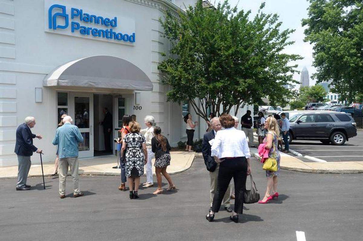 David T. Foster III/The Charlotte Observer<br/>Preparations are made in front of the new Planned Parenthood facility in Charlotte prior to a ribbon=cutting ceremony on Tuesday.