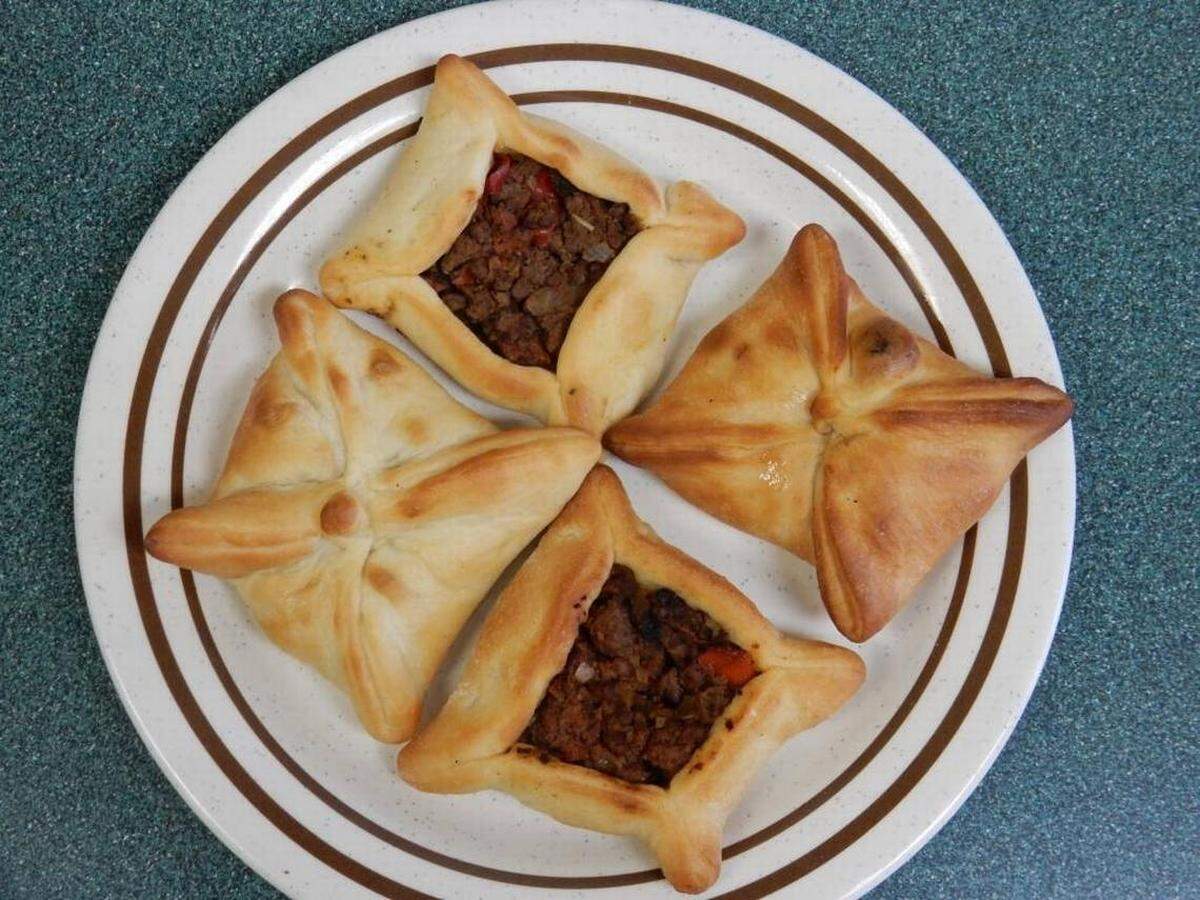 Fatayeh at Golden Bakery come four for $4.99, your choice of beef or chicken.
