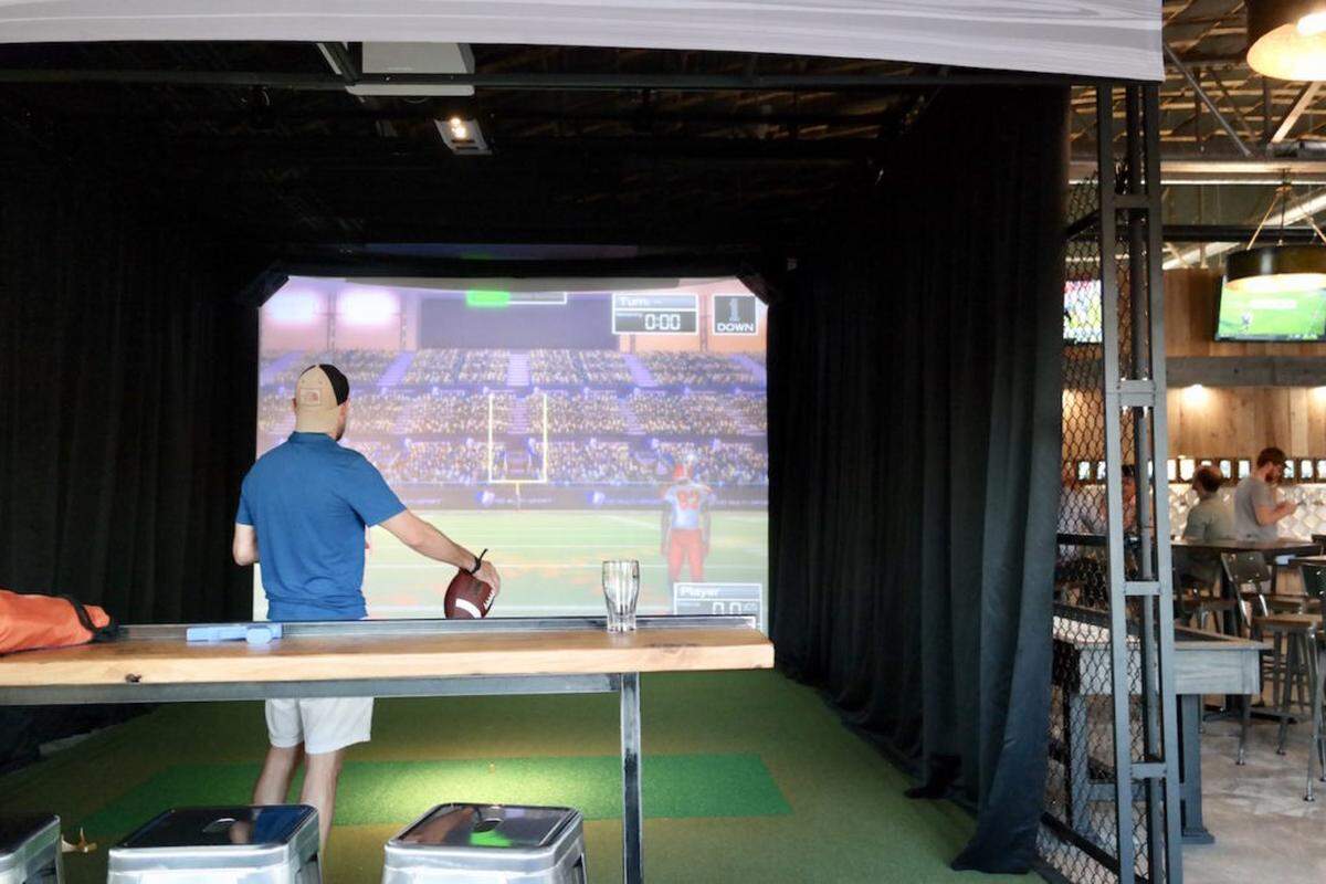 Photo by Jennings Cool<br>The sports simulator at Free Will Craft + Vine