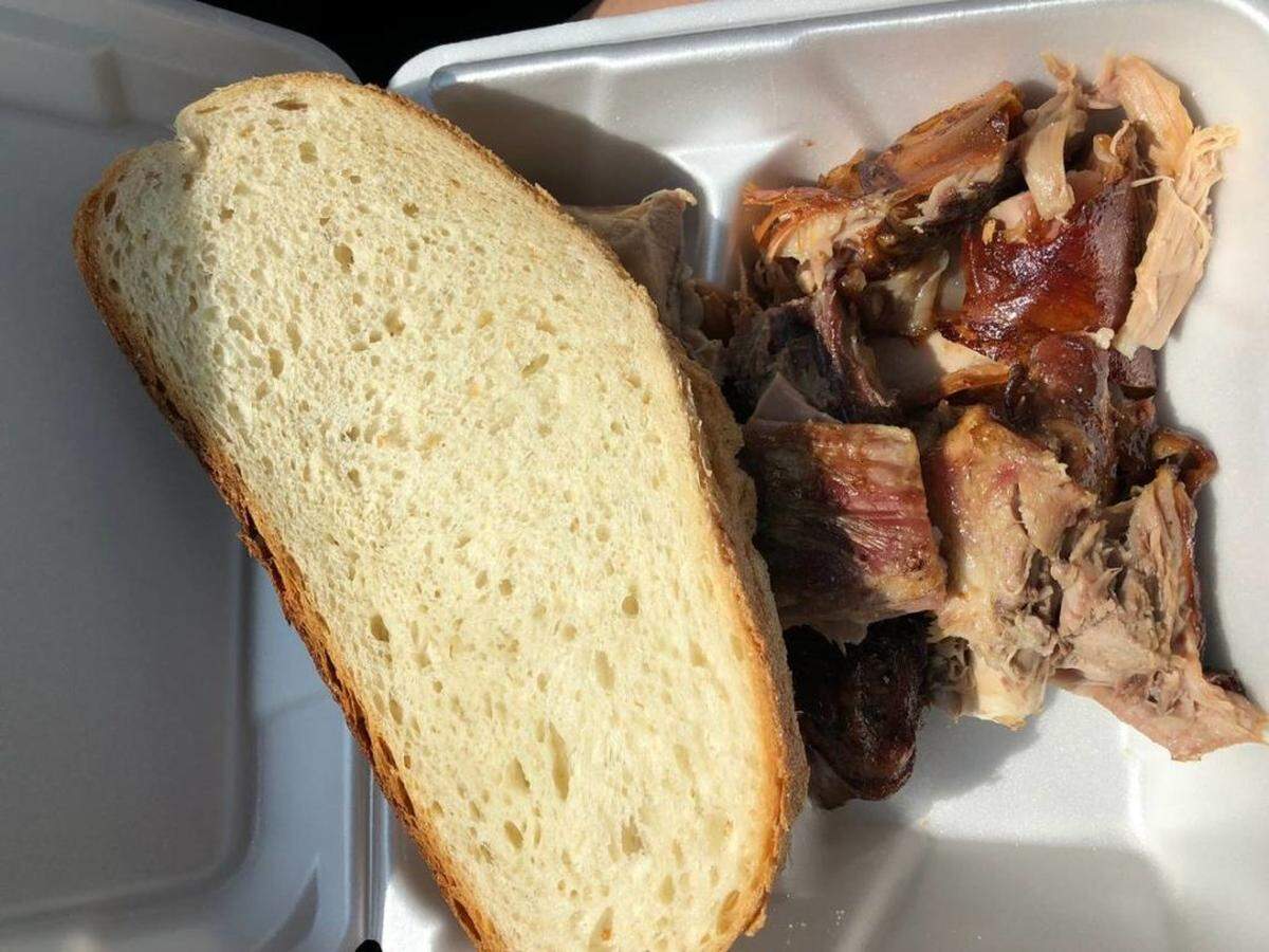 Tom Hanchett<br/>Serbian-style roast pork and bread at the St. Simeon church festival.
