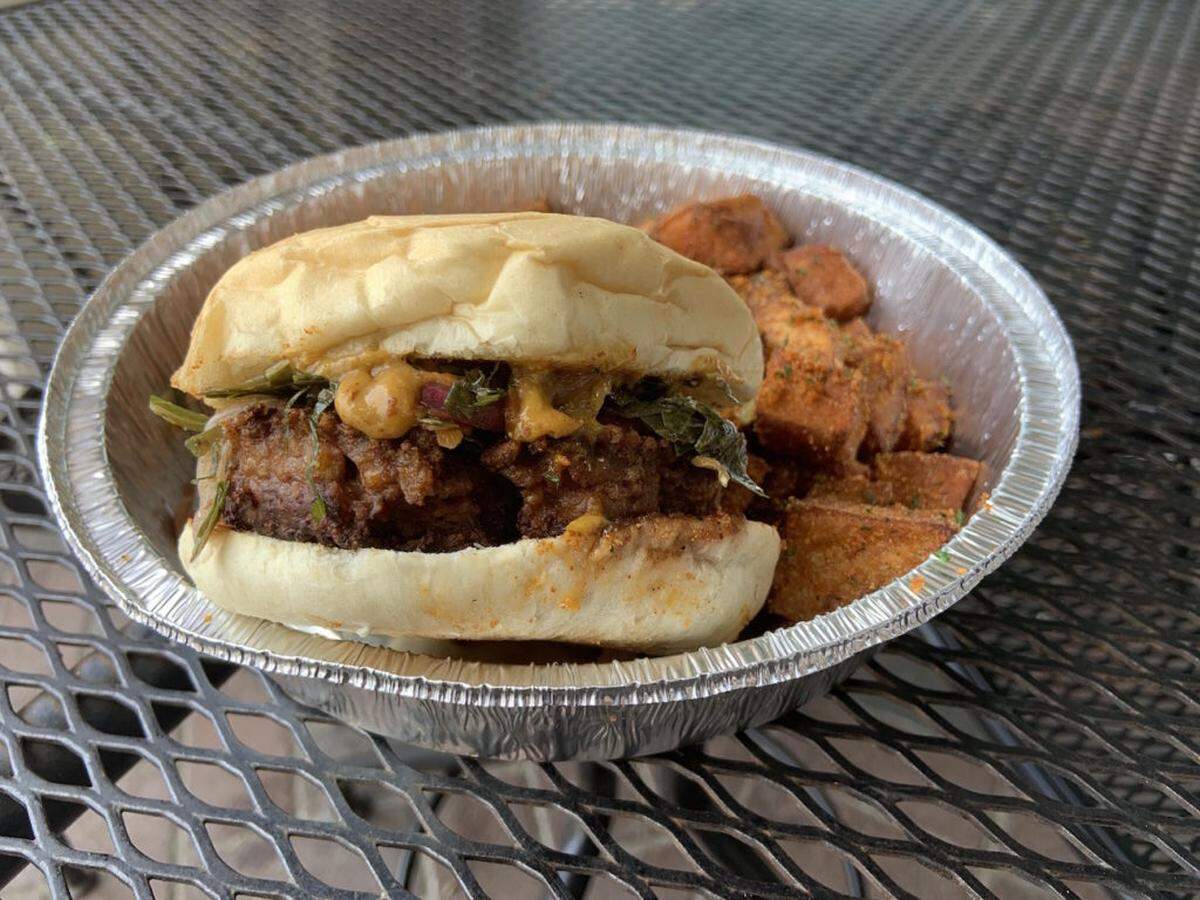 Enjoy brunch at Uptown Yolk after exploring Charlotte by bike. Pictured: The Kush Burger.