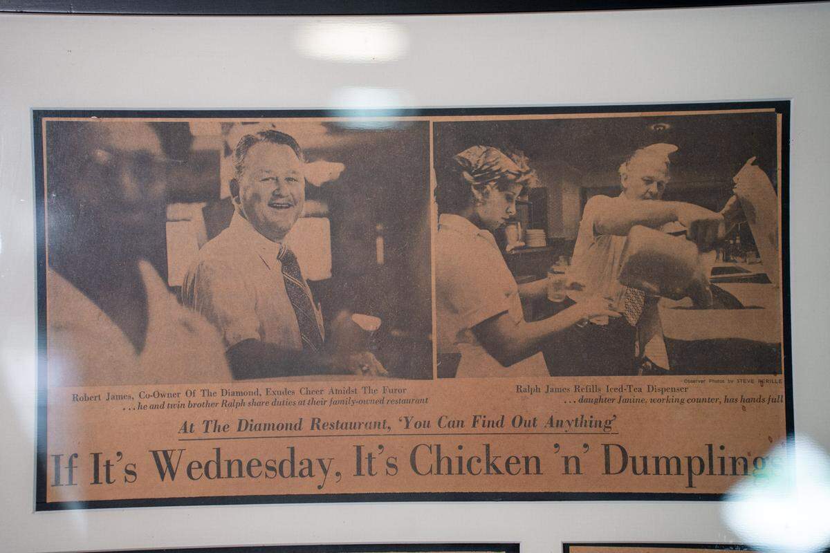 An old Charlotte Observer news clipping is framed on the wall at Diamond.