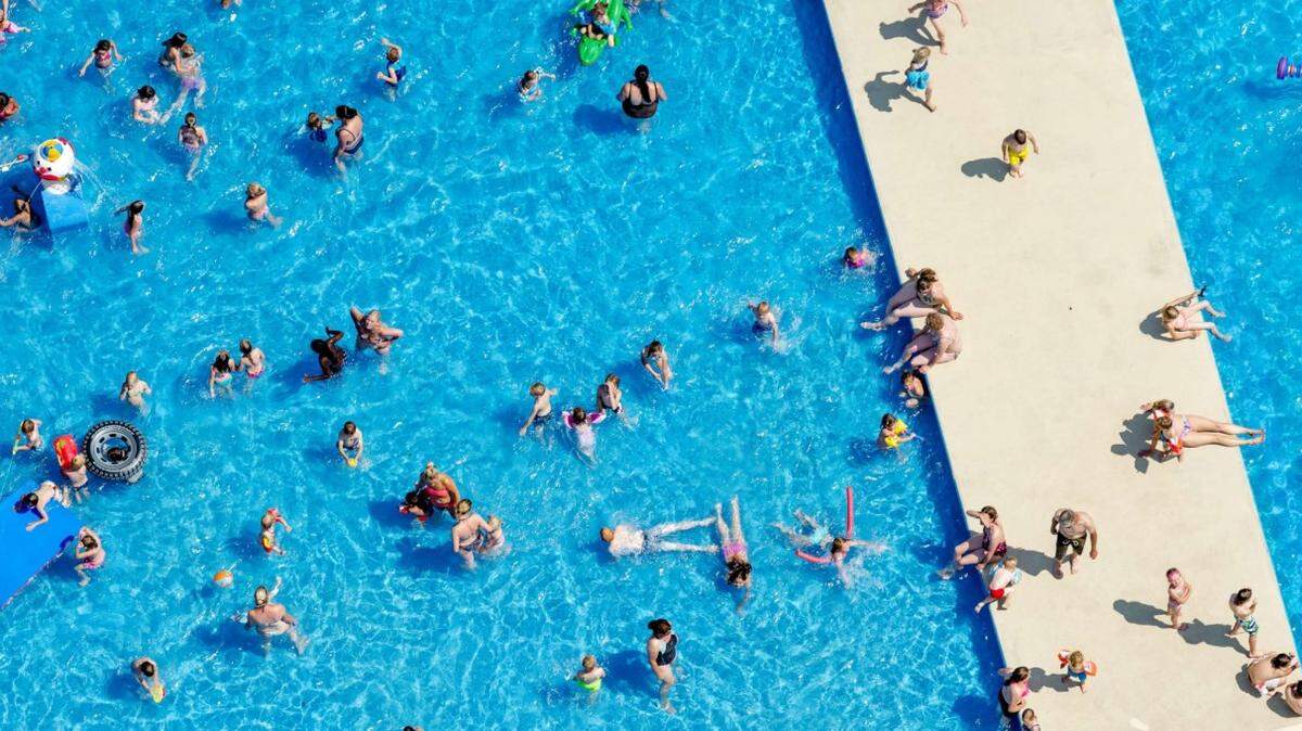 An aerial view shows sunbathers in a pool in Hazerswoude, the Netherlands, on July 1, 2015, on a warm summer day. A blistering heatwave sweeping through Europe on July 1 brought blackouts to France and fears of heat stroke for Wimbledon tennis fans. AFP PHOTO / ANP / ROBIN VAN LONKHUIJSEN 

- NETHERLANDS OUT -

ROBIN VAN LONKHUIJSEN/AFP/Getty Images