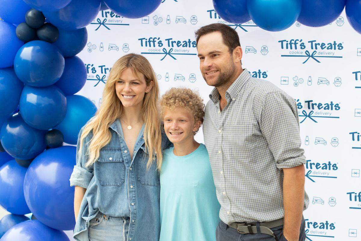 Brooklyn Decker and Andy Roddick pose with a fan at the grand opening of Tiff’s Treats at Waverly on Saturday, August 24.