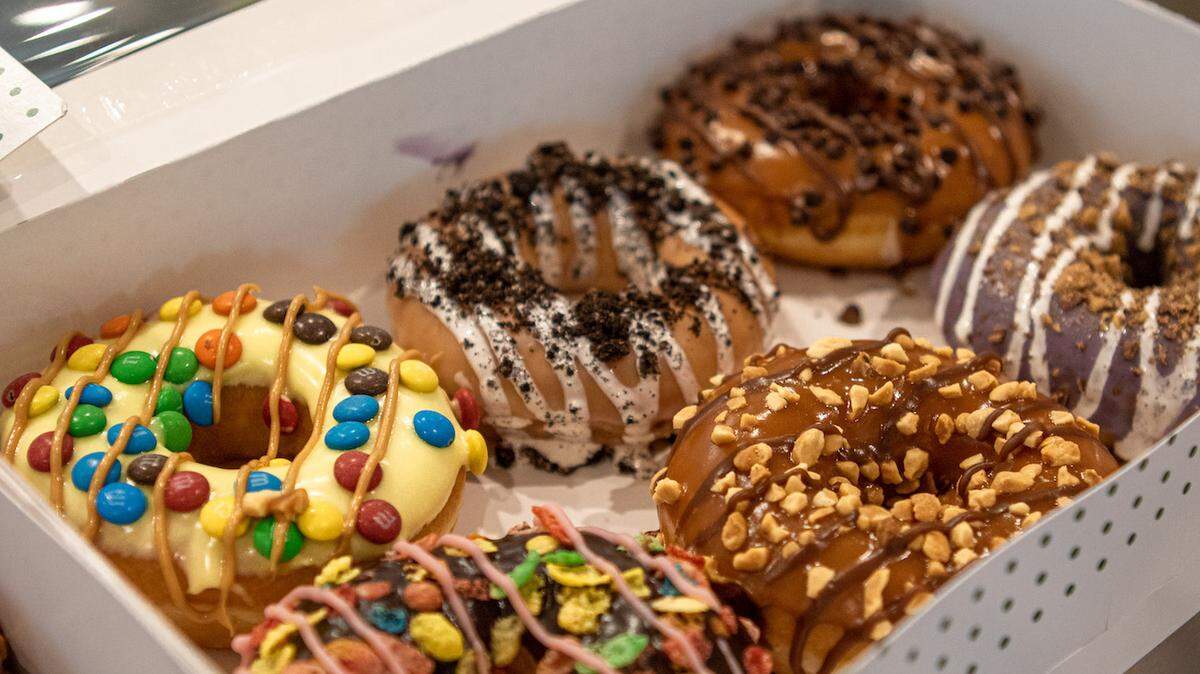 Alex Cason Photography<br/>Custom Doughnuts can be ordered at the new Krispy Kreme Concord via 3-pack or 6-pack.