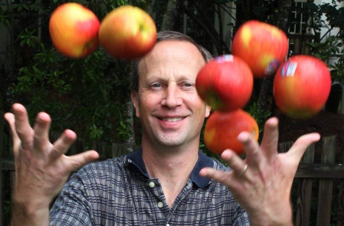 Brian Beauchemin, owner of GoodRoad CiderWorks, tosses the apples he uses to make his hard ciders into the air at his home in South Charlotte.  Beauchemin brews from his home while looking for a permanent location for his cidery. Friday, May 30th 2014Longtime homebrewer Brian Beauchemin founded GoodRoad CiderWorks and is now looking for spaces in SouthEnd. Since there's not a location yet, he is brewing from his home.
