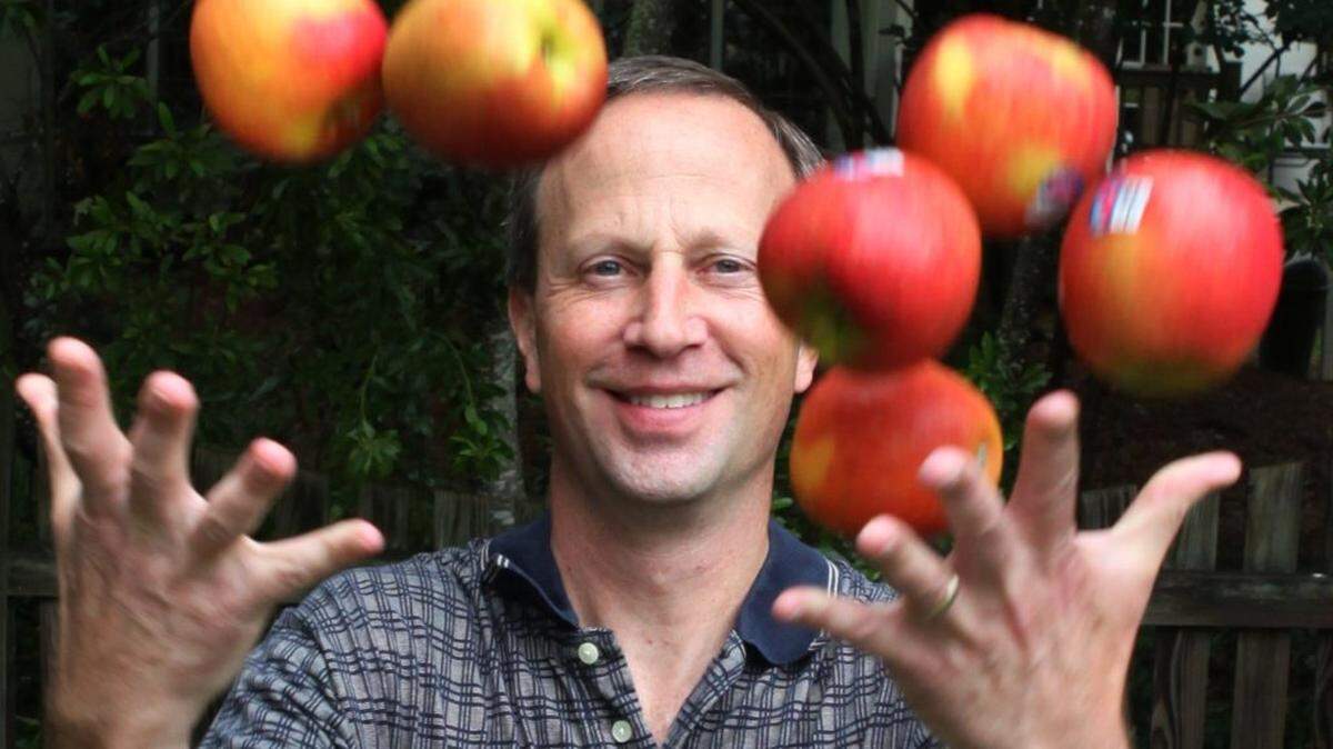 Brian Beauchemin, owner of GoodRoad CiderWorks, tosses the apples he uses to make his hard ciders into the air at his home in South Charlotte.  Beauchemin brews from his home while looking for a permanent location for his cidery. 
Friday, May 30th 2014
Longtime homebrewer Brian Beauchemin founded GoodRoad CiderWorks and is now looking for spaces in SouthEnd. Since there's not a location yet, he is brewing from his home.