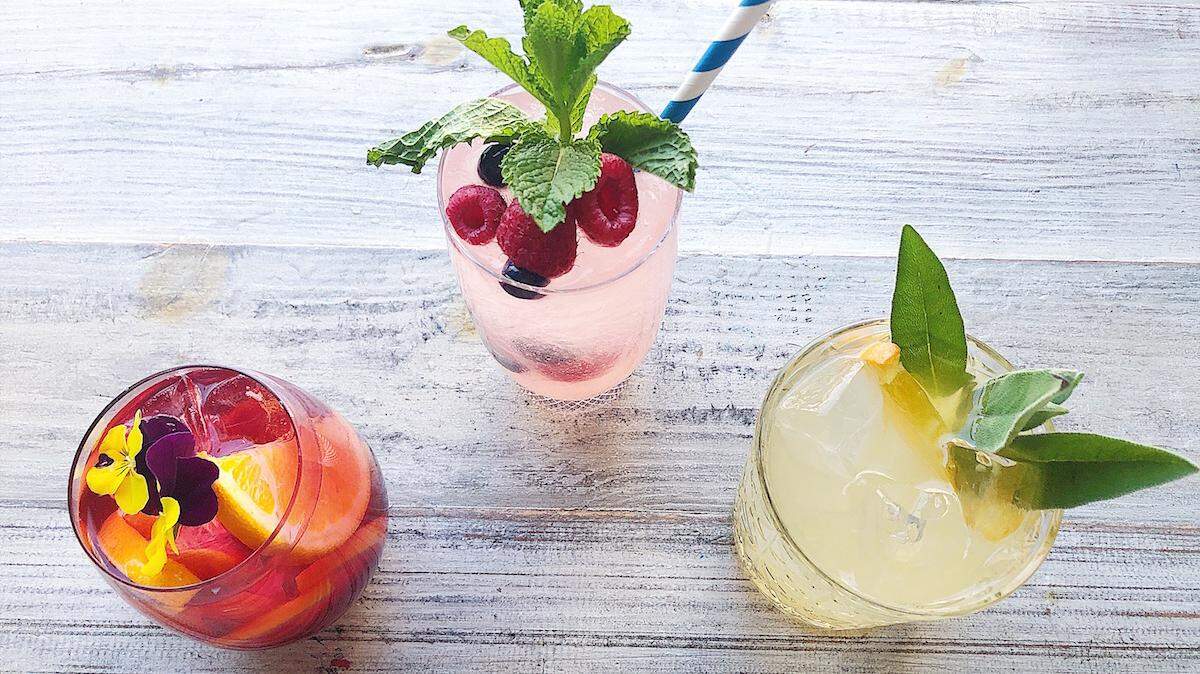Courtesy of Haberdish <br/> Haberdish's Sang’free’a (center) has fresh grape and cranberry juices, a dried fruit syrup and orgeat, a sweetener made from macadamia nuts. The menu also includes 
The Fruit and Flower Spritz, with hibiscus, grapefruit and mint; and the Ginger Fizz, with citrus, honey syrup, ginger beer and fresh sage.