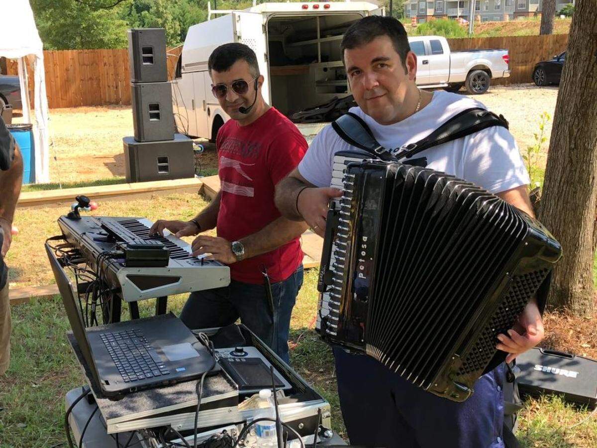 Tom Hanchett<br/>Accordion player Bratislav Manasijevic and friend at the 2018 St. Simeon festival.