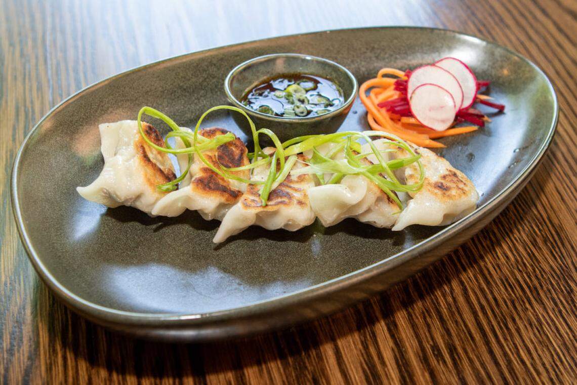 The Lucky Duck’s pork + ginger gyoza with a soy scallion sauce.