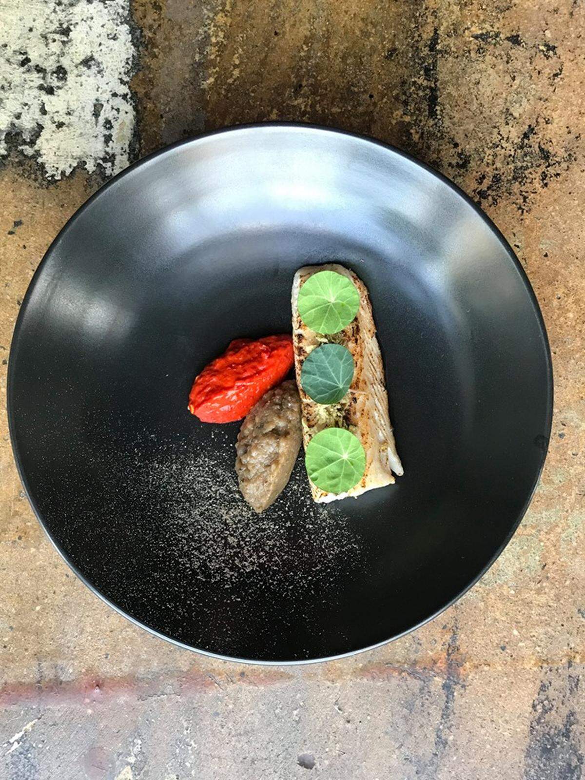 Courtesy of Bardo<br>Black cod served with eggplant, cherry peppers and ponzu