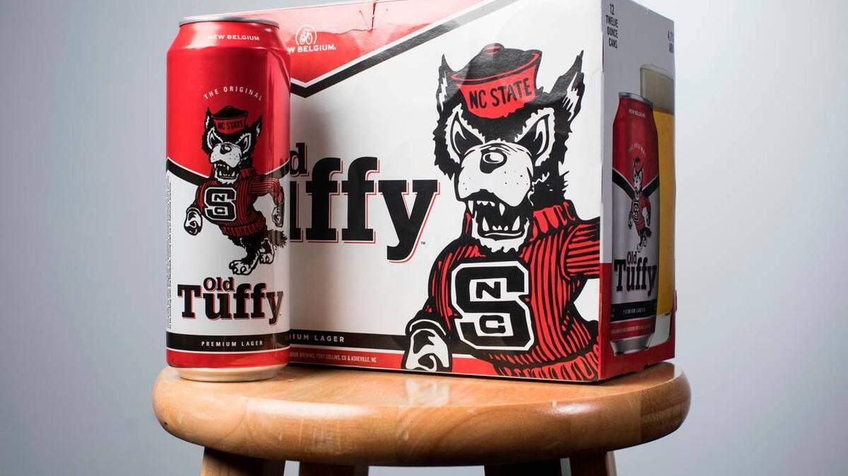 Photo by Julia Wall/News & Observer<br>Old Tuffy, a New Belgium lager, hit the shelves in the first week of August 2019. The brewing company announced the Wolfpack-themed beer earlier this summer, kicking off a five-year collaboration with NC State.