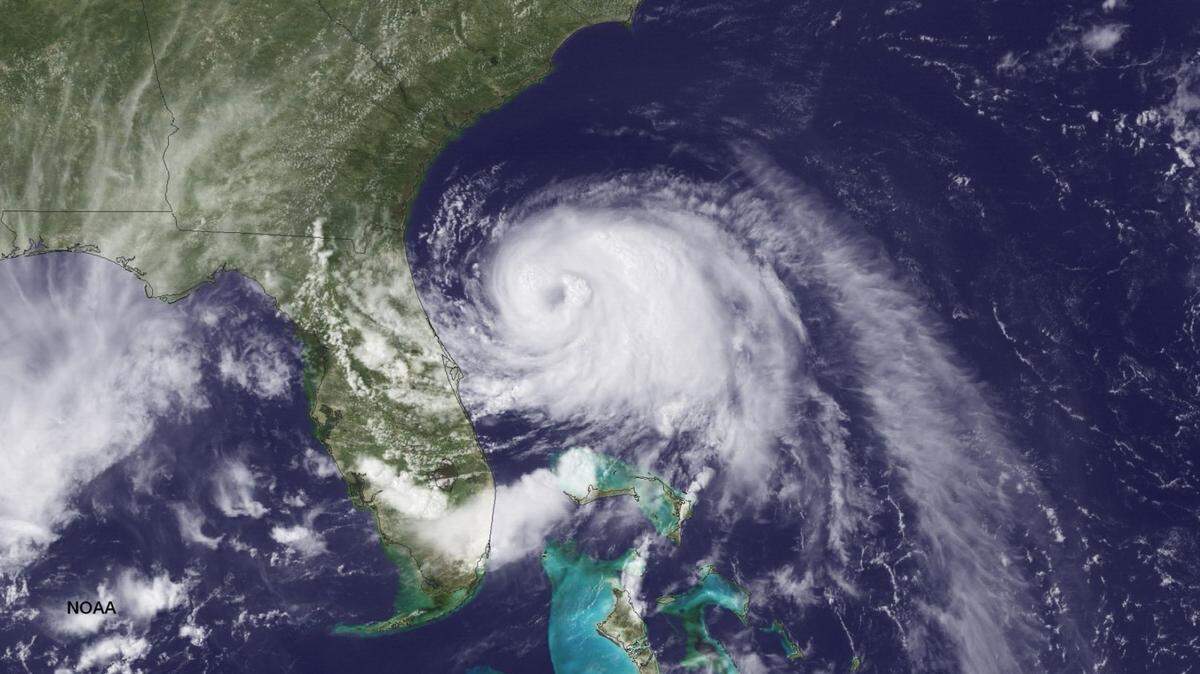UNITED STATES - JULY 2: In this handout provided by the National Oceanic and Atmospheric Administration (NOAA) from the GOES-East satellite, Tropical Storm Arthur travels up the east coast of the United States in the Atlantic Ocean pictured at 19:45 UTC/GMT on July 2, 2014. According to reports, Arthur, now with maximum sustaned winds of 70 mph, has begun moving steadily northward is expected to strike the North Carolina Outer Banks over the Fourth of July holiday. Arthur is expected to become a hurricane by July 3.   (Photo by NOAA via Getty Images)