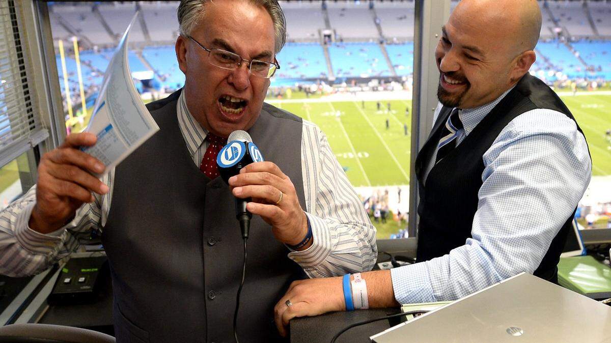Jaime Moreno, left, and Luis Felipe Moreno Jr., right, have been the Spanish broadcasters for Carolina Panthers games since 2010.