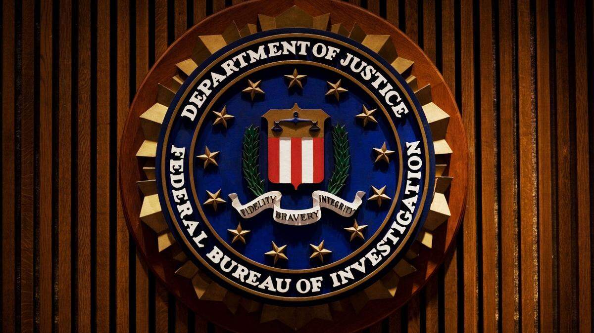(FILES) This August 3, 2007 file photo shows a crest of the Federal Bureau of Investigation(FBI) inside the J. Edgar Hoover FBI Building in Washington, DC. Federal agents on January 26, 2015 arrested an alleged Russian spy in New York accused of trying to collect economic intelligence and recruit US sources while working for a Russian bank, officials said. US prosecutors named the alleged covert intelligence agent as Evgeny Buryakov, 39. He was to appear before US Judge Sarah Netburn in a Manhattan federal court later Monday. Prosecutors said he was assisted in his illegal spying activities by Russian spies Igor Sporyshev, 40, and Victor Podobnyy, 27, who had been attached to the Russian missions in New York. Although both had been protected by diplomatic immunity they no longer live in the United States, and have been charged in absentia despite not being arrested, officials said. AFP PHOTO/MANDEL NGAN / FILESMANDEL NGAN/AFP/Getty Images