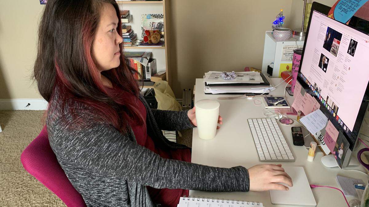 Photo by Kennieth Holmes<br/>Kim Lawson at her home office. This photo has been altered to remove sensitive information.
