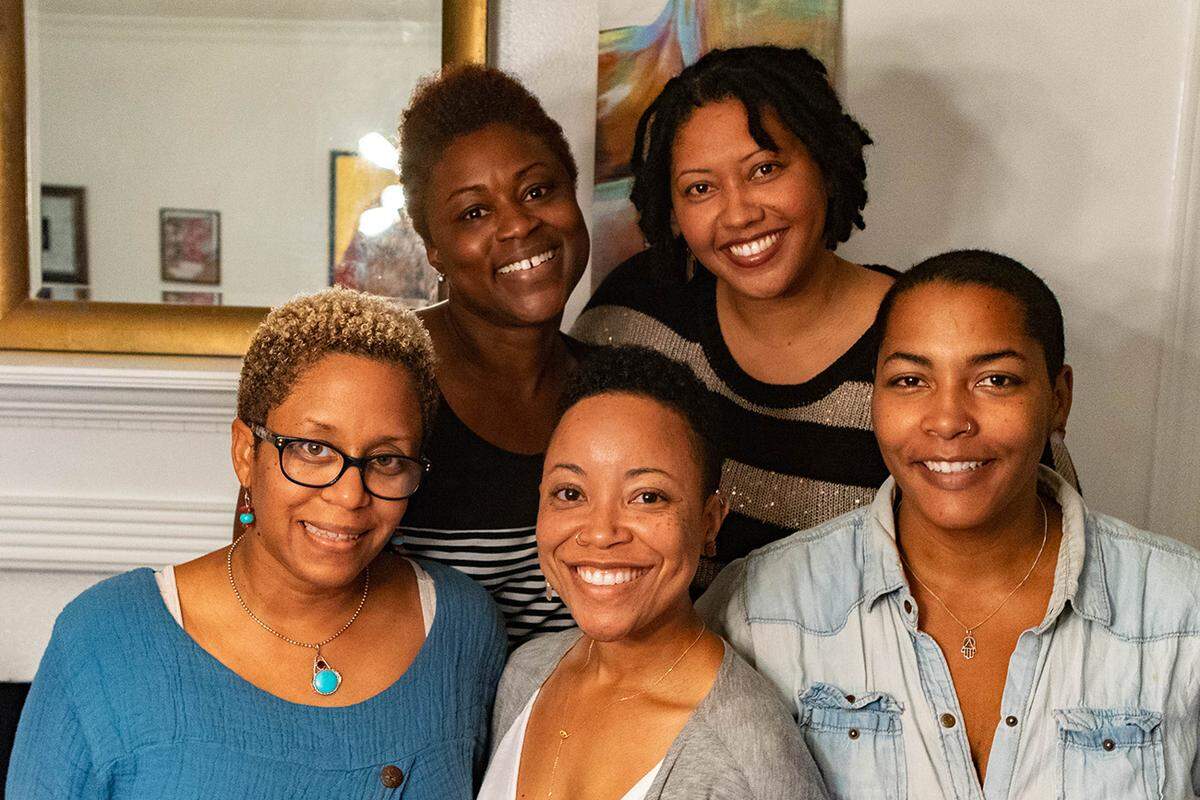Sanctuary in the City is a nonprofit formed to help healing from race-based trauma created by Charlotte women. Its organizers, shown here, have formed a yoga-centric healing space. Bottom row, from left: Christy Lee, Tiya Maynard, Kelley Carboni-Woods. Top row, from left: Tanqueray Edwards, Jasmine Hines. Not pictured: Setarra DeVeaux Robinson.
