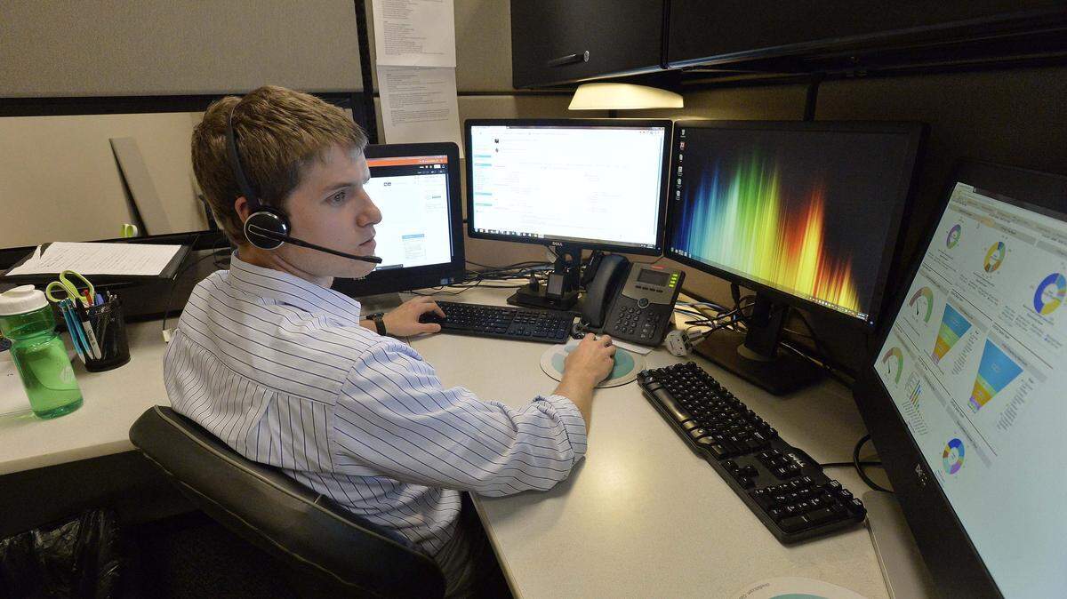 Andy Fisher sales rep for Cloudbilt on the phone  at Cloudbilt offices on Wednesday Aug. 20,2014. Cloudbilt is included in a ranking of Inc.'s top 5,000 fastest growing private companies in America. Out of that 5,000, five companies in Charlotte are listed in the top 500 companies growing the fastest. Cloudbilt is ranked as no. 227