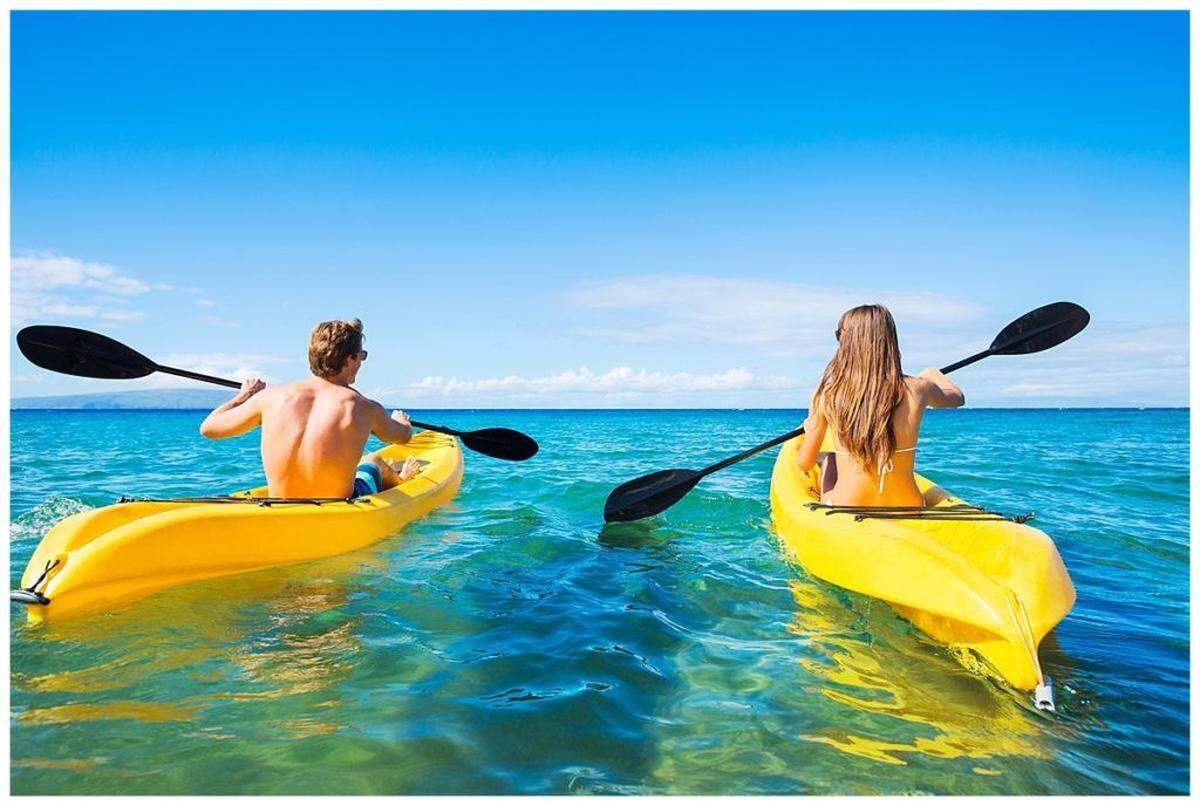 Couple Kayaking in the Ocean on Vacation