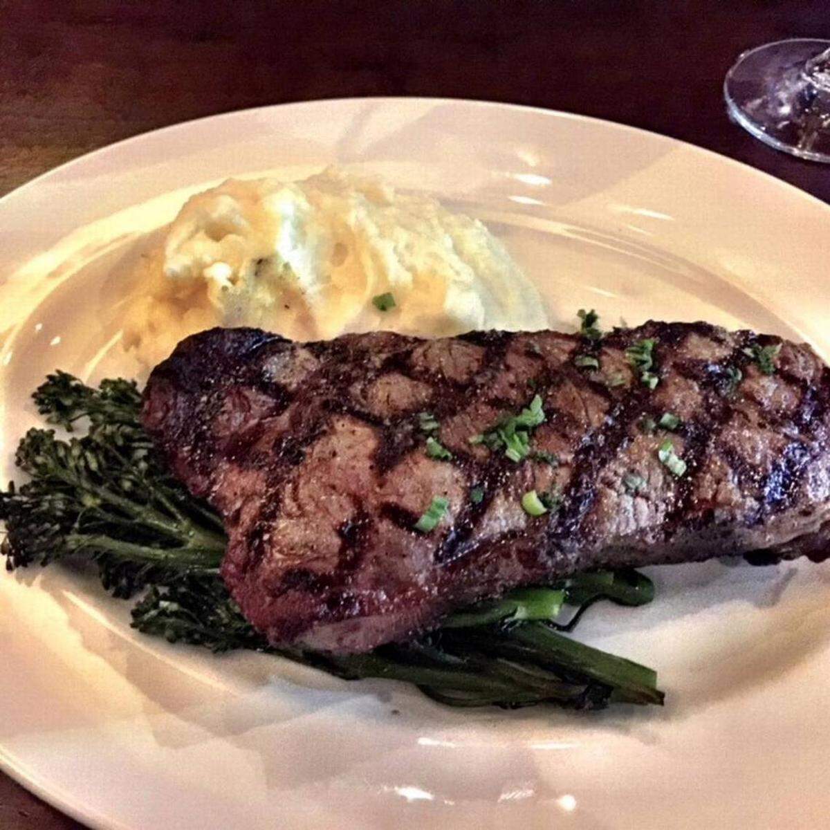South Park Grill’s 14-ounce center-cut New York Strip is $37. Unlike other pricier steaks, it does come with potatoes and broccolini.Photo by Kathleen Purvis