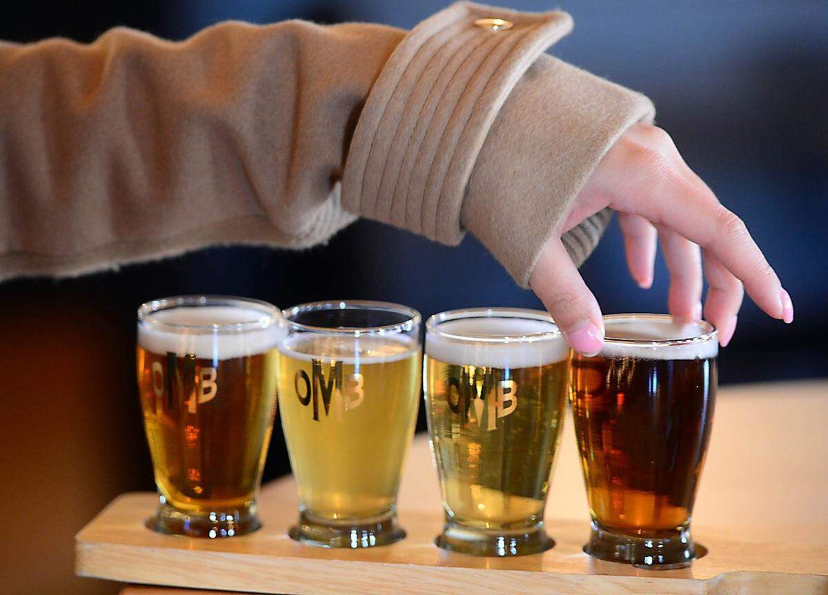 A customer samples the beer selection at the Olde Mecklenburg Brewery.