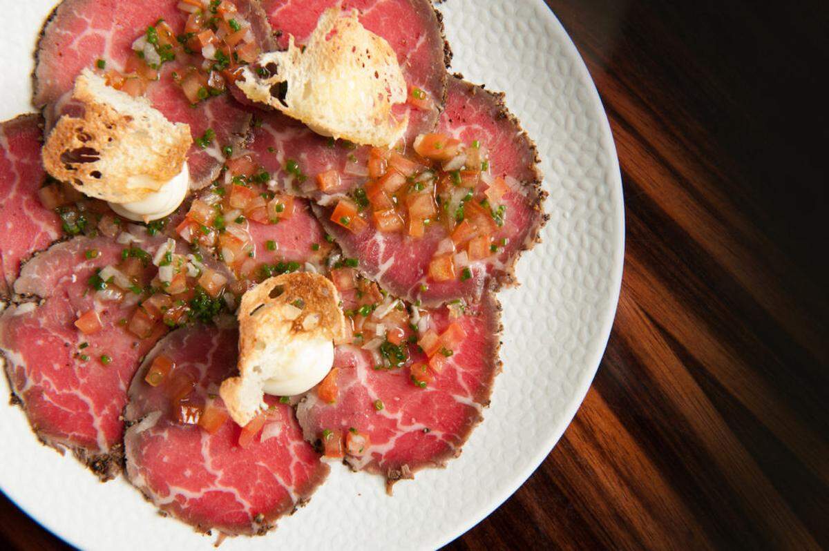 The Smoked Beef Carpaccio ($16) gets a tasty twist with the addition of a parmesan ganache on top.